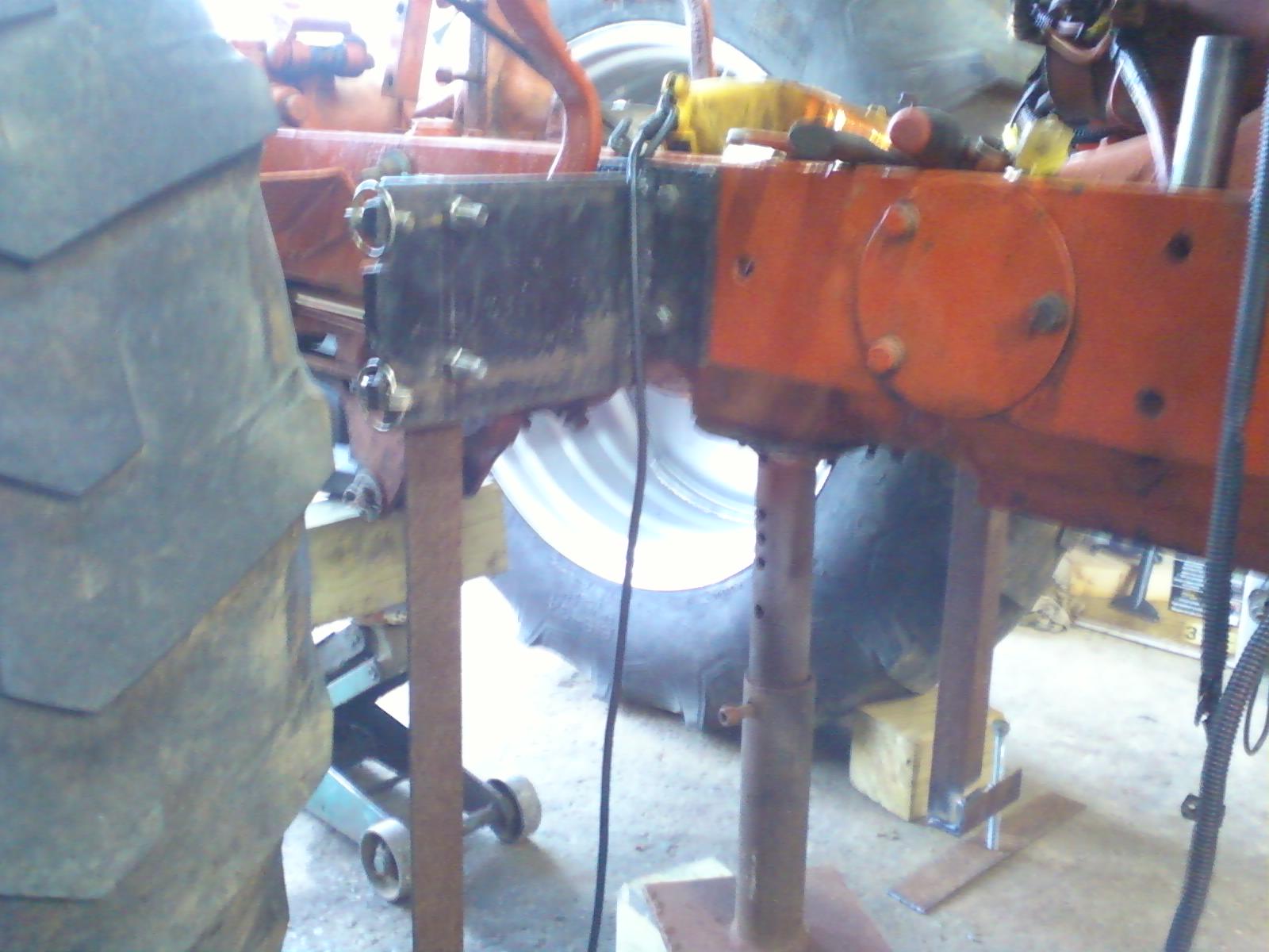 I supported the tractor on each side with two braces with adjusters to help stabilize the tractor.